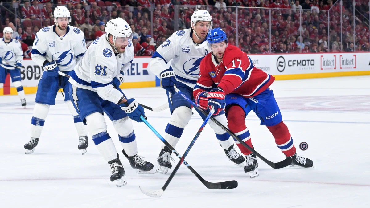Montreal Canadiens forward Josh Anderson (17) plays the puck and Tampa Bay Lightning defenseman Erik Cernak (81) defends during the third period in game three of the first round of the 2026 Stanley Cup Playoffs at the Bell Centre.