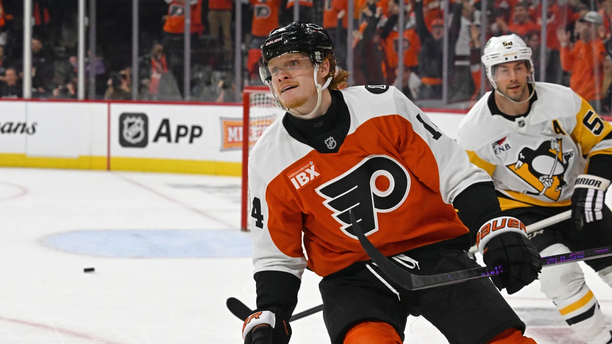 Philadelphia Flyers right wing Owen Tippett (74) celebrates his empty net goal against Pittsburgh Penguins defenseman Kris Letang (58) during the third period in game three of the first round of the 2026 Stanley Cup Playoffs at Xfinity Mobile Arena.