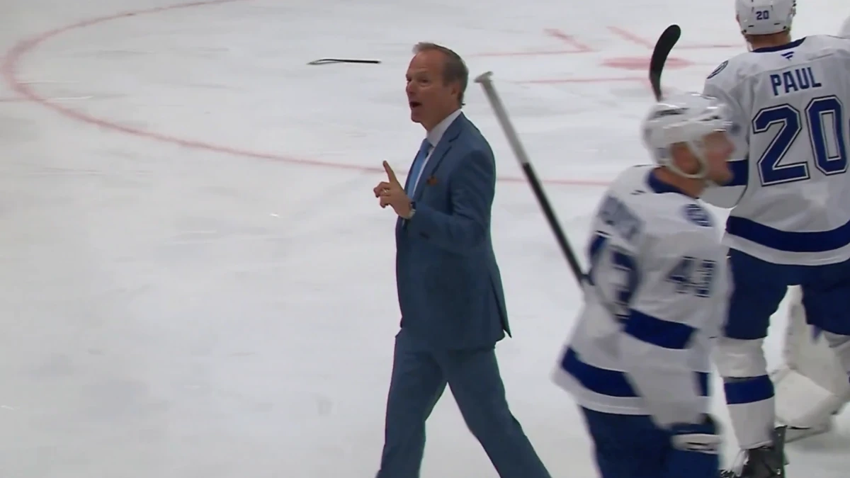 Photo of Tampa Bay Lightning head coach Jon Cooper taunting Canadiens fans.