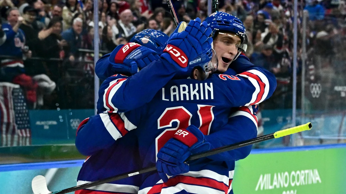 Dylan Larkin of United States celebrates with teammates after scoring their first goal against Sweden in a men's ice hockey quarterfinal during the Milano Cortina 2026 Olympic Winter Games at Milano Santagiulia Ice Hockey Arena.