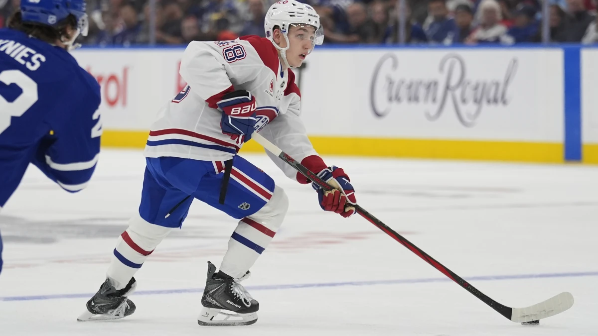 defenseman Lane Hutson (48) carries the puck against the Toronto Maple Leafs during the second period at Scotiabank Arena.