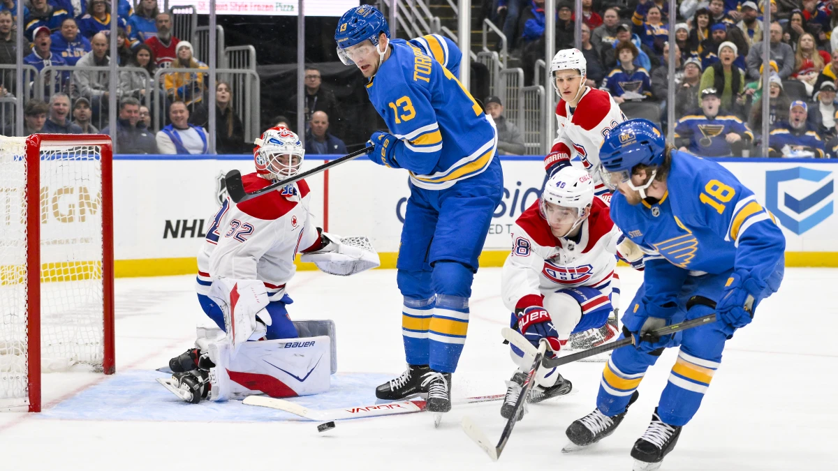 St. Louis Blues center Robert Thomas (18) scores a shorthanded goal against Montreal Canadiens defenseman Lane Hutson (48) and goaltender Jacob Fowler (32) during the second period at Enterprise Center.