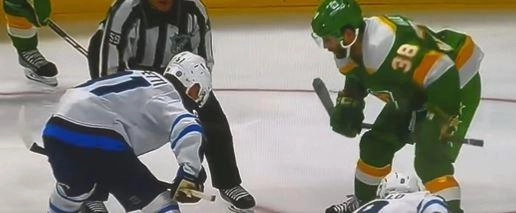 Faceoff between Cole Perfetti and Ryan Hartman prior to a intentional high stick