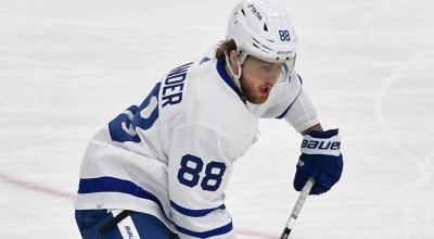 William Nylander focusing on the puck during a game.