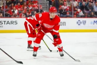 Detroit Red Wings winger Patrick Kane lined up for a faceoff in a home game.