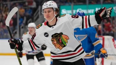 Connor Bedard celebrating after a goal for the Blackhawks.
