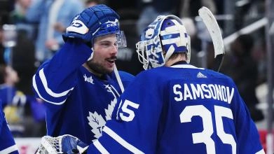 Toronto Maple Leafs Auston Matthews, Left, giving a pat on the head to Toronto Maple Leafs' goaltender Ilya Samsonov, Right.