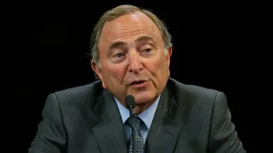 NHL commissioner Gary Bettman giving a speech.