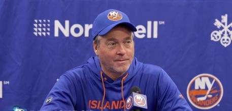 New York Islanders head coach Patrick Roy addressing the media prior to a game.