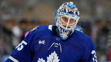 Ilya Samsonov, goaltender for the Toronto Maple Leafs, skating to the corner during an NHL game.