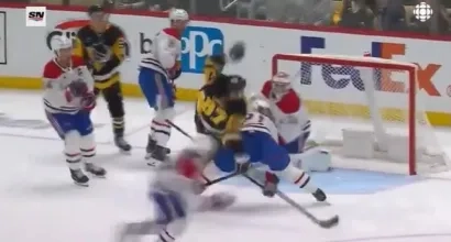 Sidney Crosby falling on his back during an NHL game against the Montreal Canadiens