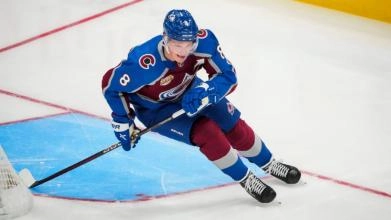 Cale Makar Skating behind the net during warmup.
