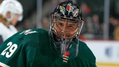 Marc-Andre Fleury, goaltender for the Minnesota Wild, smiling during a game.
