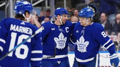 Toronto Maple Leafs Captain John Tavares embraces teammate William Nylander.