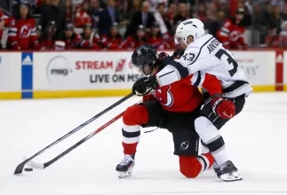Jack Hughes & Viktor Arvidsson battle for a loose puck during the second period.
