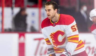 Calgary Flames defenseman Noah Hanifin skaing on the ice during a pre-game warm-up.