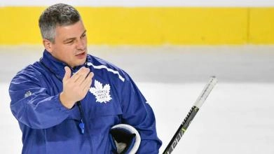 Toronto Maple Leafs head coach Sheldon Keefe giving instructions during a practice.