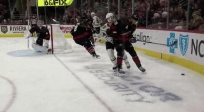Chicago Blackhawks forward Connor Bedard being hit by Carolina Hurricanes forward Sebastian Aho.