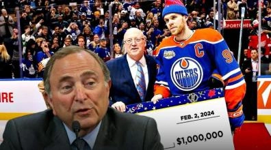 Connor McDavid accepting his 1 Million Dollar cheque for winning the NHL Skills Competition with Gary Bettman imposed to the left of the image.