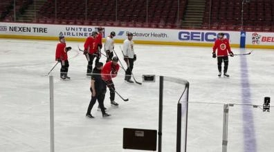Chicago Blackhawks players at practice after Seth Jones received a puck near the neck.