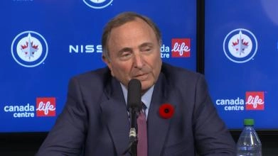 NHL commissioner Gary Bettman hosting a press conference in Winnipeg.