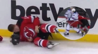 New York Rangers forward Matt Rempe throwing a big hit