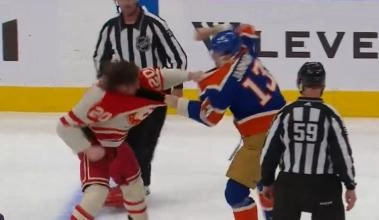 Edmonton Oilers' Mattias Janmark fighting against Calgary Flames' Blake Coleman.