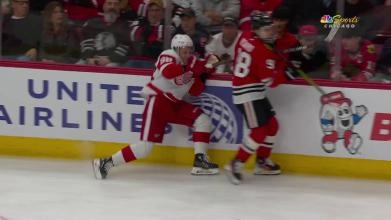 Detroit Red Wings veteran Patrick Kane and Chicago Blackhawks rookie Connor Bedard colliding