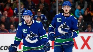 Vancouver Canucks captain Quinn Hughes with star forward Elias Pettersson.