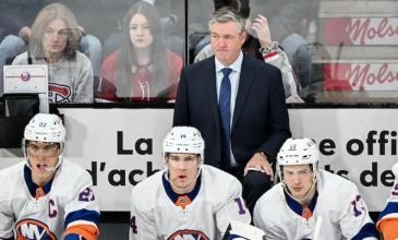 New York Islander head coach Patrick Roy behind the bench in a game.