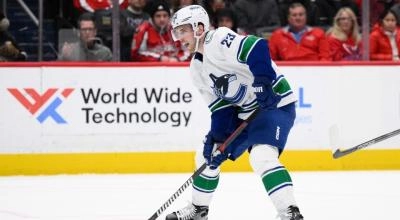 Vancouver Canucks center Elias Lindholm preparing to shoot the puck
