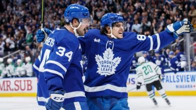 Toronto Maple Leafs prospect forward Nick Robertson celebrating a goal with Auston Matthews