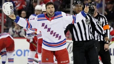 Former New York Ranger Tony DeAngelo taunting the New Jersey crowd after a scuffle against the New Jersey Devils