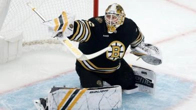 Boston Bruins goaltender Linus Ullmark making a blocker save