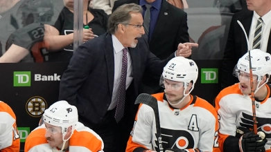 Flyers head coach John Tortorella yelling at the officials from the bench