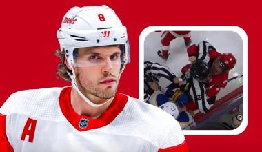 Detroit Red Wings defenseman Ben Chiarot trying to get to Buffalo Sabres' Jordan Greenway with the linesman Ben O'Quinn during a game.