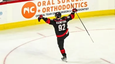 Carolina Hurricanes center Evgeny Kuznetsov doing his classic eagle celebration after his first goal with his new team