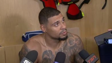 Ryan Reaves without a shirt on doing an interview after a game with the Toronto Maple Leafs.