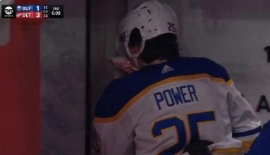 Buffalo Sabres' defenseman Owen Power leaving the ice after receiving a puck in the face during a game against the Detroit Red Wings.