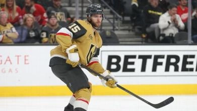 Vegas Golden Knights defenseman Noah Hanifin skating on defense during a home game in the 2023-24 NHL season.