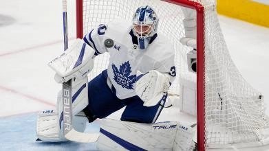 Matt Murray during a game for the Toronto Maple Leafs making a save.