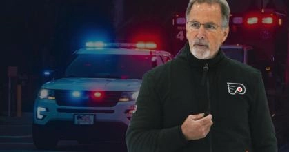 Philadelphia Flyers head coach John Tortorella and a cop car.