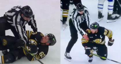 Brad Marchand being tackled by referee
