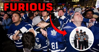NHL referees huddling to discuss a potential call with Maple Leafs fans
