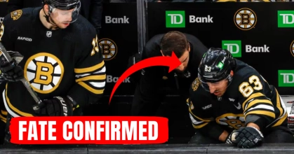 Boston Bruins captain Brad Marchand in pain on the bench.