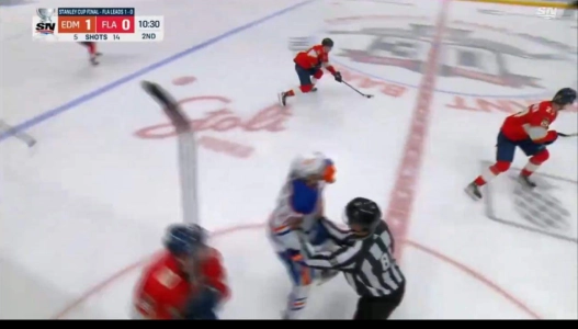 NHL official interferes with Edmonton's Connor Brown.