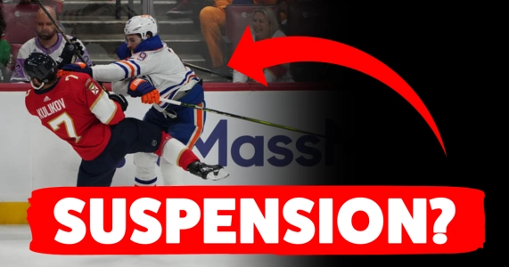Leon Draisaitl cross checking Aleksander Barkov