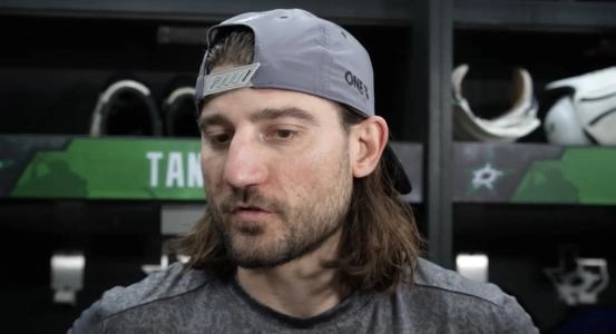 Dallas Stars defenseman Chris Tanev speaking to the media during his time with the team.