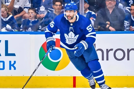 Mark Giordano skates during an NHL game while a member of the Toronto Maple Leafs