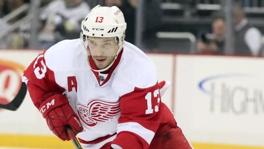 Detroit Red Wings legend Pavel Datsyuk playing in an away game for the team against the Pittsburgh Penguins during his playing career.
